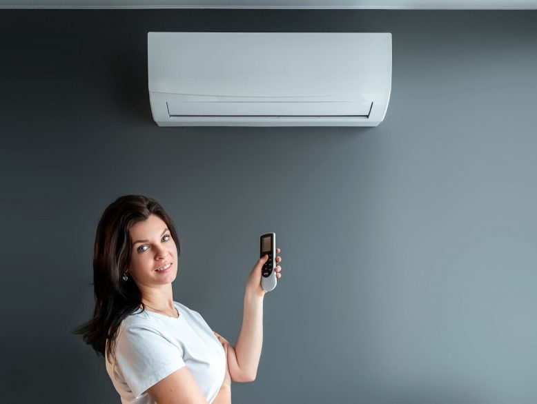 beautiful-girl-stands-air-conditioning-stream-fresh-cold-air-against-gray-wall-concept-heat-cool-air-cooling-freshness