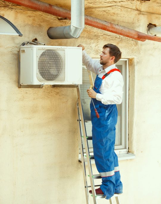 hvac-technician-working-capacitor-part-condensing-unit (1)