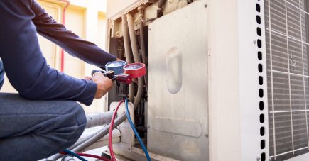 technician-is-checking-air-conditioner-measuring-equipment-filling-air-conditioners